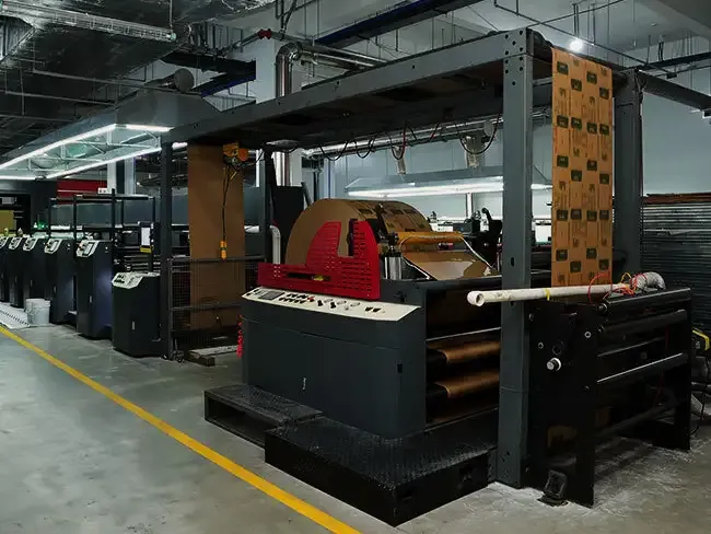 High-speed flexographic press running packaging sheets.